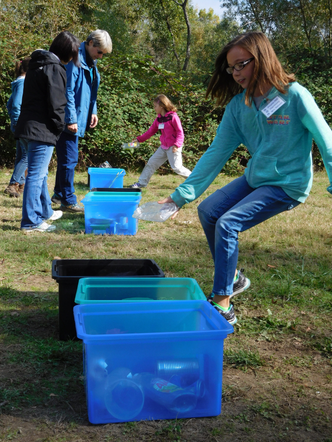 Prune Hill students see who can be the fastest at sorting recycling and garbage at the Columbia River Watershed Festival at Cottonwood Beach.