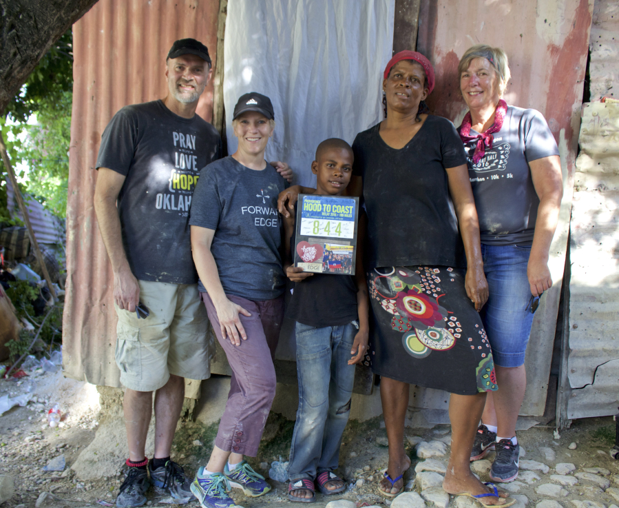 Ken and Jen Goheen of Camas (left) raised $10,000 with their Hood to Coast team to help a widow in Haiti build a new home. (Photo by Carola Strolger)