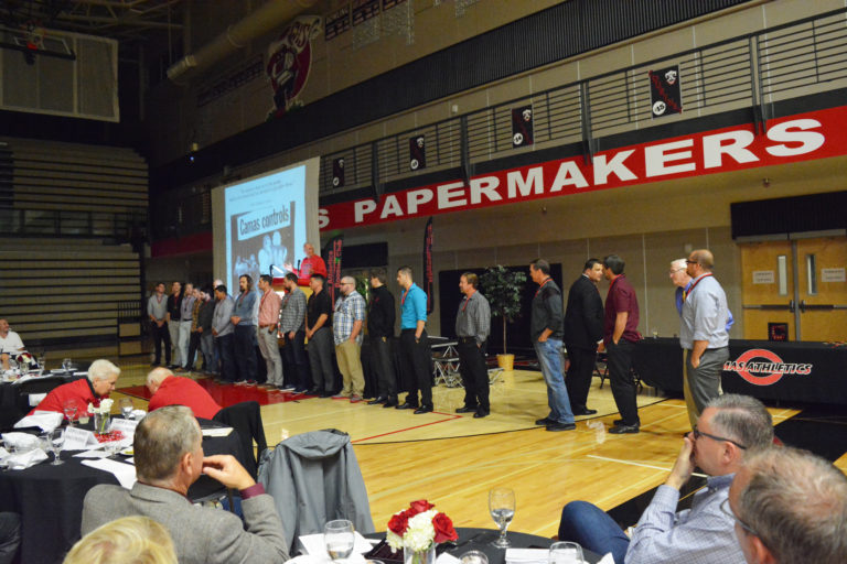 Bob Holman introduces the members of the 2005 Camas High School team that attended the Hall of Fame ceremony. Each player and coach was inducted for capturing the school's first league championship in 36 years.