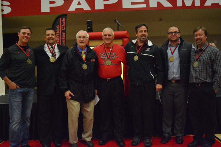 Bob Holman (center) shares a proud moment with his coaching staff from the 2005 season. That team won the first league football championship for Camas since 1969.