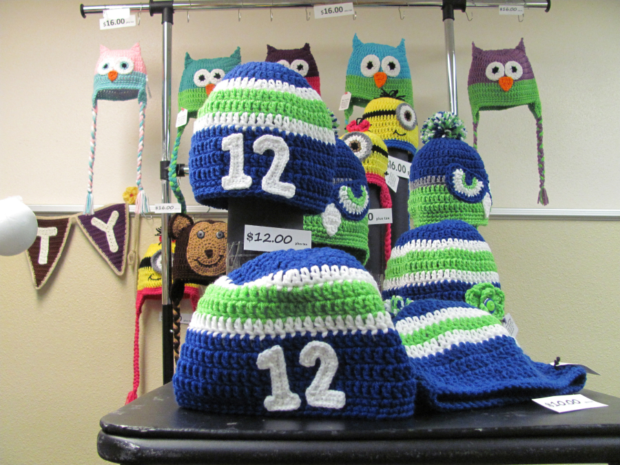 Knitted caps featuring animals and Seahawks inspired designs were featured at the Holly Days bazaar at Liberty Middle School. (Post-Record file photo)