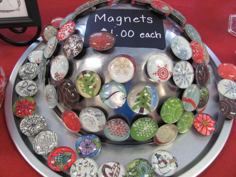 Colorful holiday magnets are one of the many inexpensive items found at area bazaars. (Post-Record file photo)