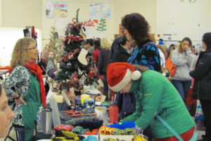 Attendees peruse tables at last year's Holly Days Craft Bazaar in Camas. The annual event is a fundraiser for the Camas High School drug- and alcohol-free grad party. (Post-Record file photo)