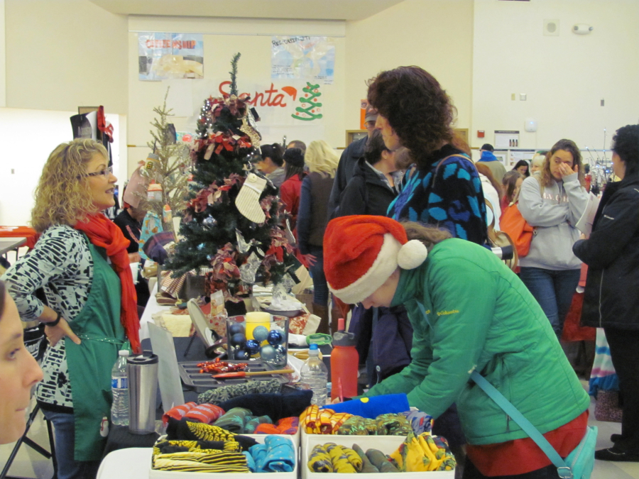Attendees peruse tables at last year's Holly Days Craft Bazaar in Camas. The annual event is a fundraiser for the Camas High School drug- and alcohol-free grad party. (Post-Record file photo)