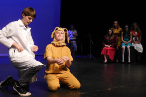 John N. Fail (Sean Finucane) administers veterinary assistance to Dog (Tori Corkum). "Failure: A Love Story," opens this Friday at the Washburn Performing Arts Center at Washougal High School.