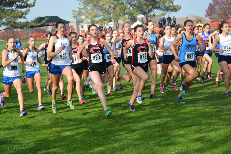 The Camas girls cross country team takes off from the starting line at the state championship race Saturday, on the Sun Willows Golf Course in Pasco. The Papermakers finished in second place. 