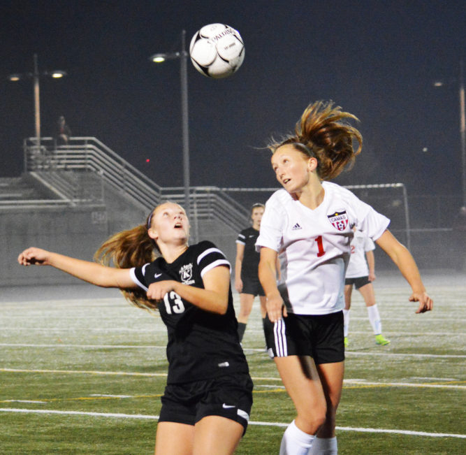 Sabine Postma heads the soccer ball forward for Camas Nov. 9, at Doc Harris Stadium.