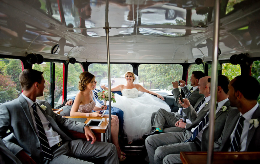 A bride takes everything in on a bus tour. (Photo courtesy of MoscaStudios)