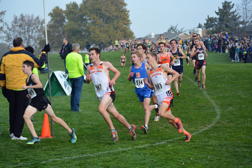 Washougal runners Aiden Pullen and Gabriel Dinnel make the turn at the first mile of the 2A boys state cross country race.