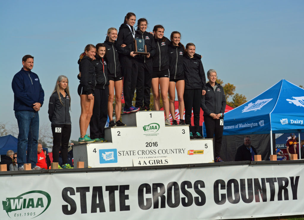 The Camas High School girls cross team stands on the podium in second place at state.
