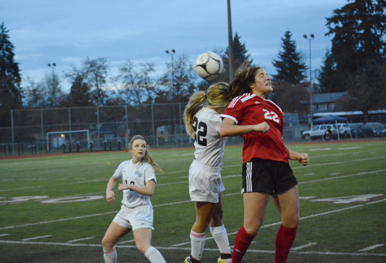 Alyssa Tomasini nudges the soccer ball forward at the start of the state championship game. She scored the winning goal for the Papermakers in the semifinals.