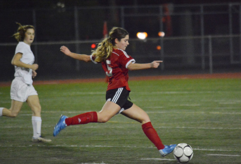 Morgan Winston kicks in the final goal for Camas in a 3-0 victory against West Valley, Yakima.