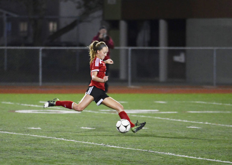 Sabine Postma delivers a 30-yard goal for the Papermakers midway through the second half of the state championship game. Photo by Kris Cavin.
