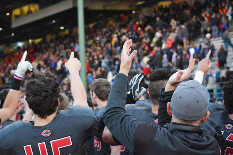 Head coach Jon Eagle (right) and the Camas High School football players thank the hometown fans for cheering them on to a 45-21 victory against Sumner in the semifinal round of the 4A state tournament Nov. 26, at McKenzie Stadium.