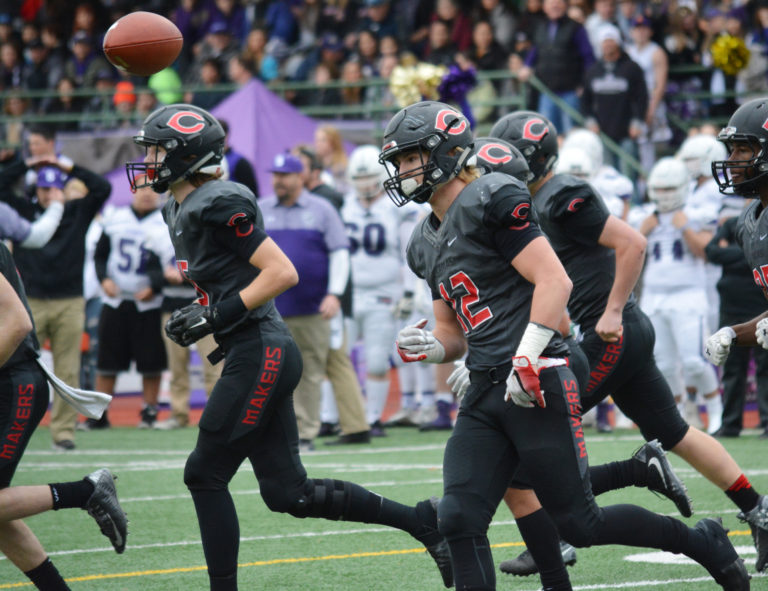 Michael Matthews flings the football back to the official after scoring a touchdown for Camas on the first drive of the state semifinal game Nov. 26, at McKenzie Stadium. The Papermakers defeated Sumner 45-21.
