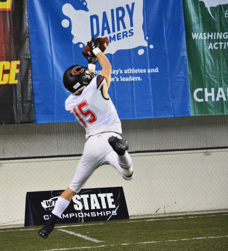 Cooper McNatt touches down in the end zone with the football in his hands. This play gave Camas a 7-0 lead after the first drive of the state championship game Saturday, at the Tacoma Dome.