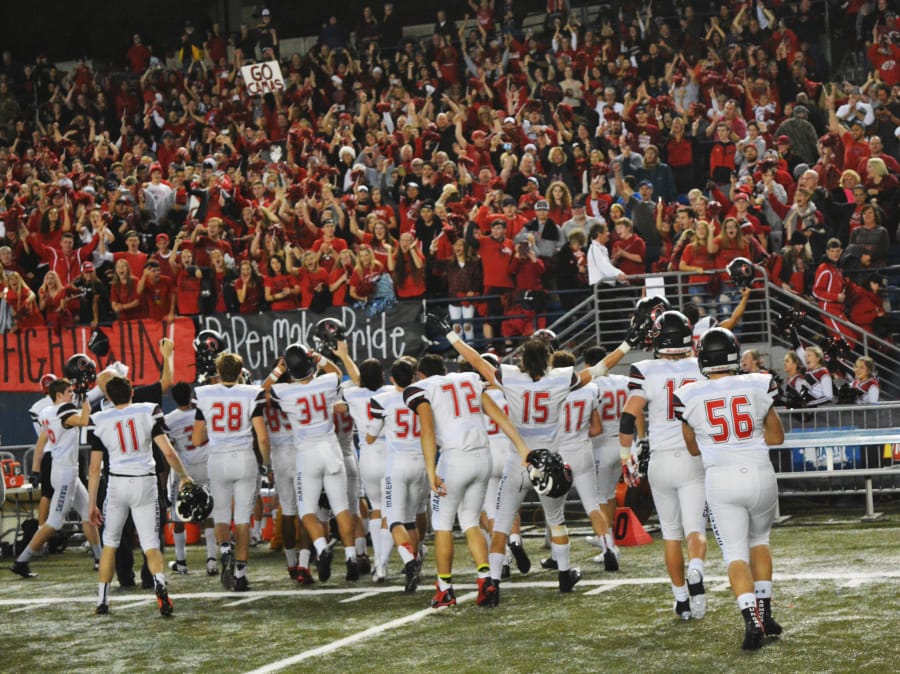 The Camas football players celebrate with their fans after winning it all at the Tacoma Dome Saturday.