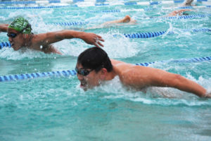 Washougal's Isaiah Ross (top) and Camas' Mark Kim push each other during practice Monday, at Lacamas Swim & Sport. 