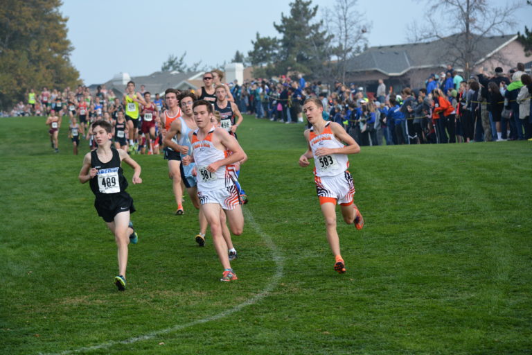 Washougal runners Aiden Pullen and Gabriel Dinnel make the turn at the first mile of the 2A boys state championship race.