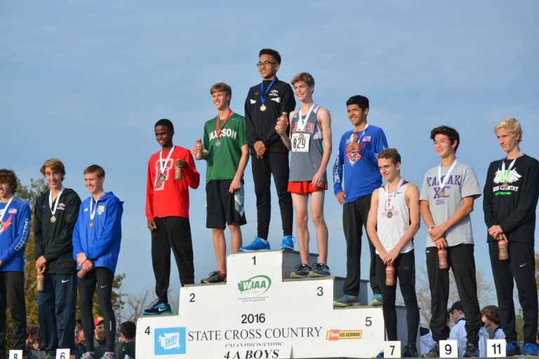 Yacine Guermali stands on top of the podium in first place for Camas at the 4A boys cross country state championship meet in Pasco on Nov. 5.