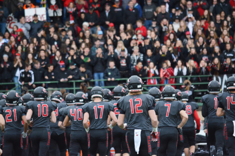 The Camas High School football team gets ready for the opening kickoff in the state semifinal game.