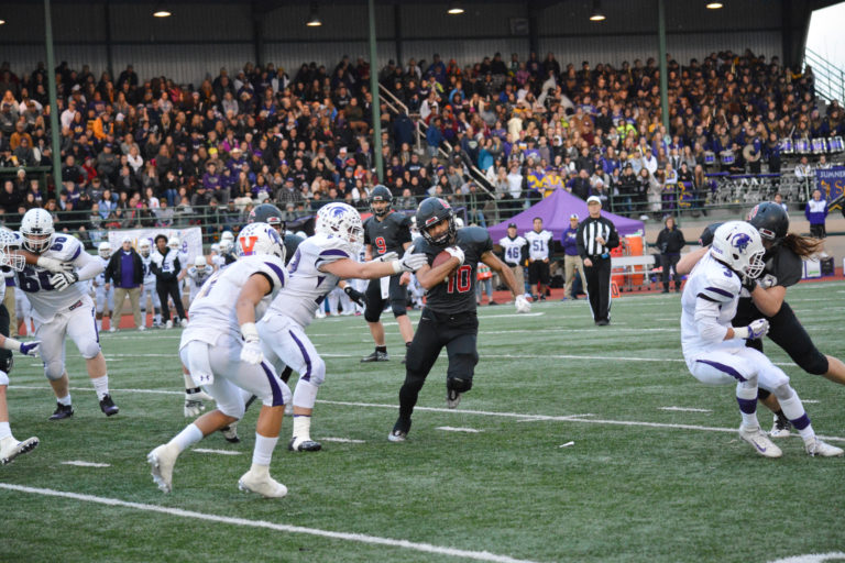 Elias Bashir on the run to the final touchdown of the game for the Camas football team.