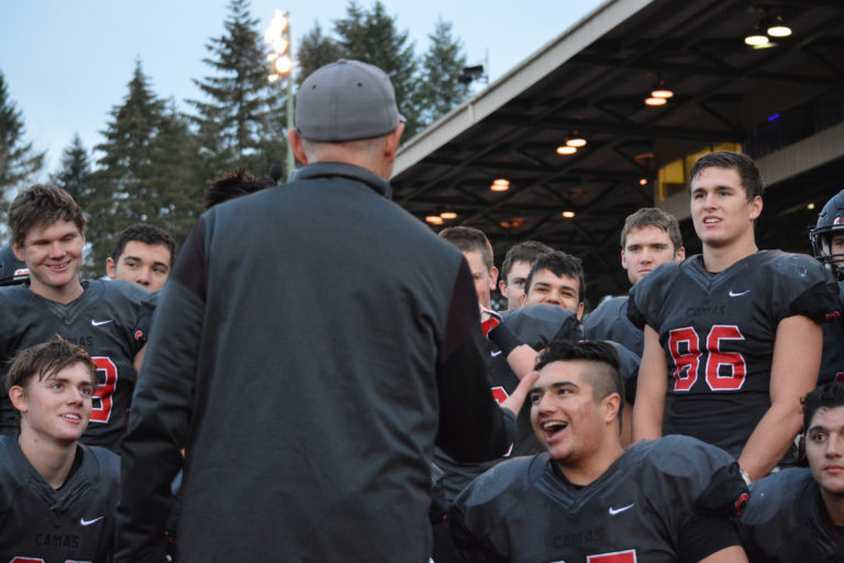 Camas head coach Jon Eagle tells the football players how proud he is of them for making it back to the Tacoma Dome to play in the state championship game.