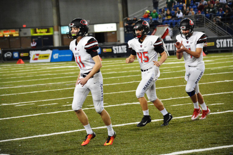 Michael Boyle (11) earns redemption from 2013 after kicking a 34-yard field goal to give Camas a 10-7 lead against Richland at halftime in the state championship game at the Tacoma Dome. He is followed by Carter Kinkead and Kyle Allen.