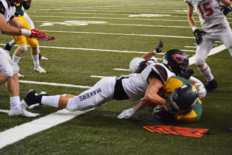 Sedric Ruiter grounds a Richland Bomber on fourth down to get the ball back for Camas in the final minutes of the fourth quarter.