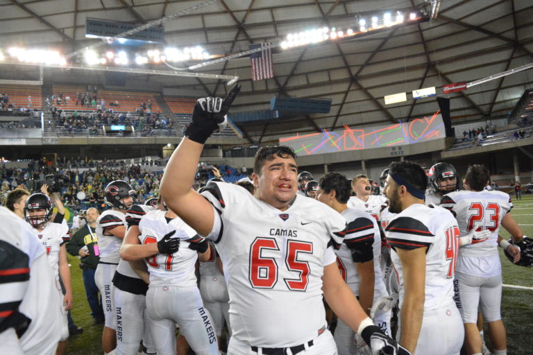 JT Tumanuvao points to the Camas fans after the Papermakers won the state championship at the Tacoma Dome.