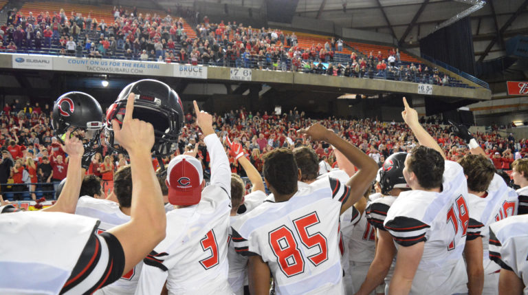 The Camas football players give thanks to their fans for cheering them all the way a state championship victory at the Tacoma Dome.