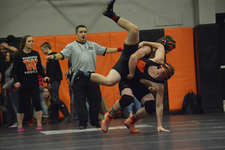 Michael Hickey takes down Aaron Douglas in a match between two Panthers.