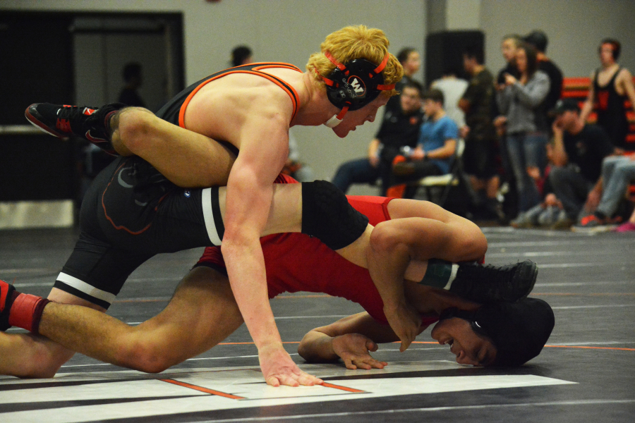 Washougal's Tanner Lees squashes R.A. Long's Owen Eniquez to become the Washougal River Rumble 145-pound champion. 