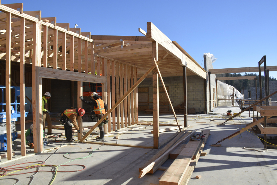 Employees frame a portion of the exterior walls at the new Columbia River Gorge Elementary School. 