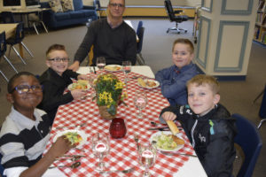 Left to right, Jamal Jackson, Drew Schupbach, Washougal schools Superintendent Mike Stromme, Ashton Odd, and Ethan Crombie Faulkner enjoy a "fine dining," experience at Gause Elementary School, complete with table linens and a four-course meal. (Contributed photo)