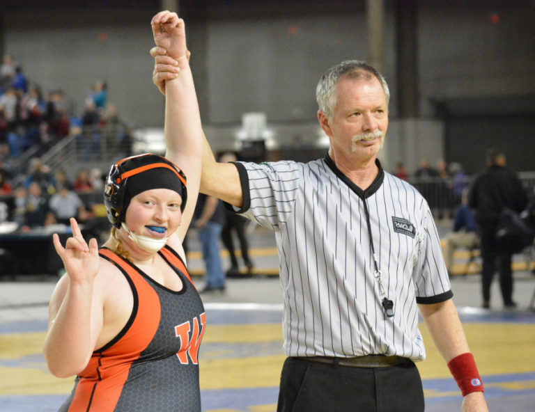 Abby Lees gets her hand raised after winning the 235-pound girls wrestling state championship for Washougal Saturday, at the Tacoma Dome.