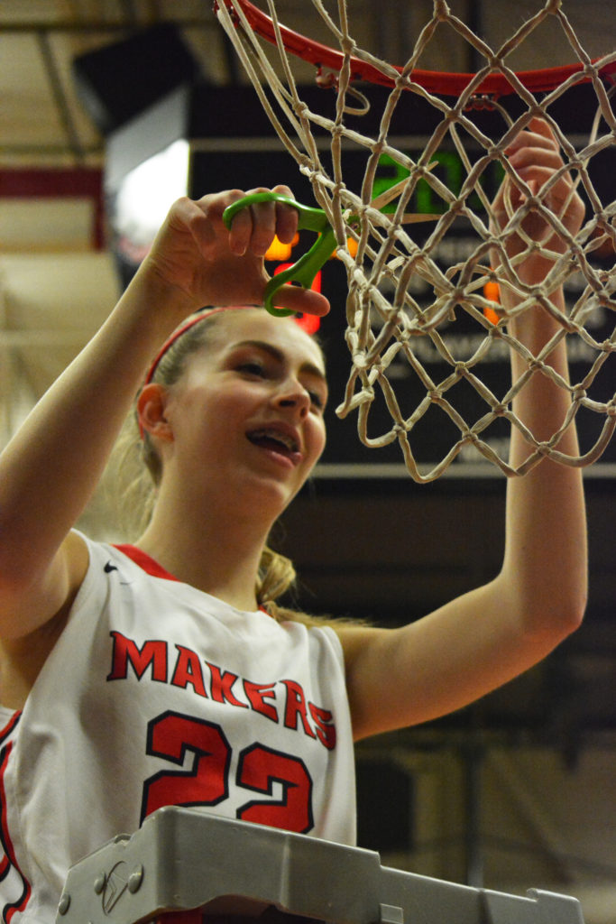 Madison Freemon cuts away at the net.