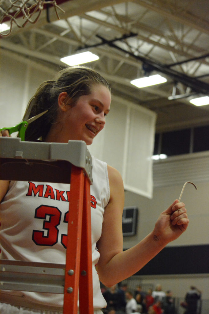 Courtney Clemmer holds a piece of Camas history.