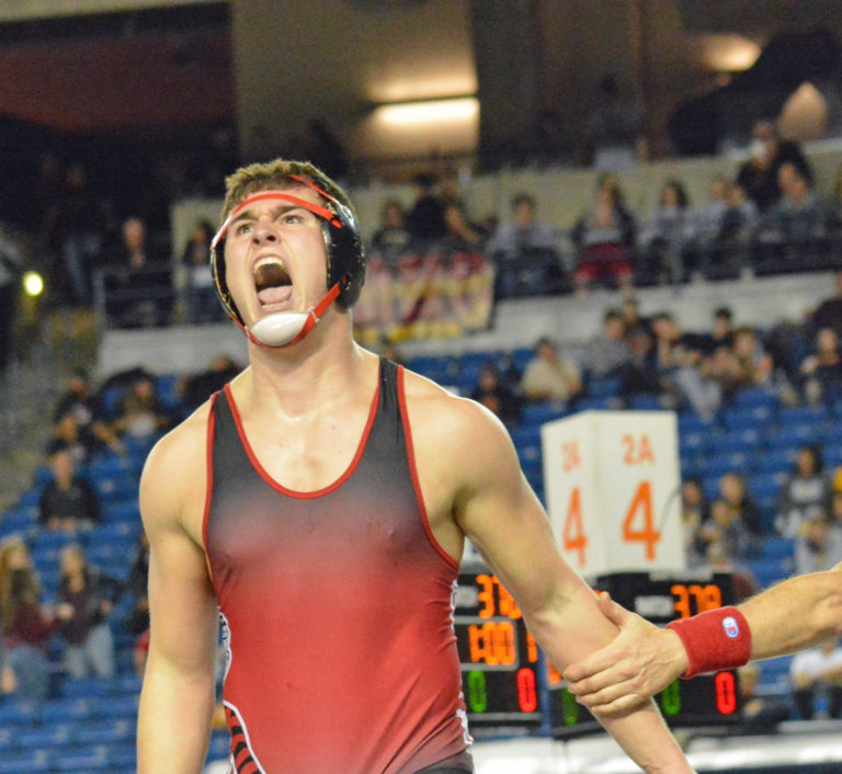Camas High School senior Dylan Ingram screams with passion after winning the 4A 220-pound state wrestling championship at the Tacoma Dome Saturday.