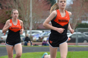 Amelia Pullen (right) won the 1,600- and the 3,200-meter races for Washougal March 23, at Columbia River High School. Hannah Swigert (background) grabbed first place for the Panthers in the 800.