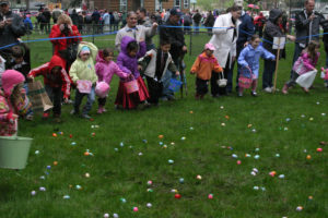 Eager children dash to collect candy and prize-filled eggs at the Camas Parks and Recreation Easter Day Hunt at Crown Park.