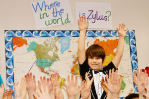 Zylus Italiano waves goodbye to his second-grade classmates at Cape Horn-Skye Elementary before embarking on a world trip in February with his family.