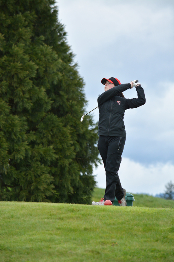 Emma Cox watches her tee shot land on the green during the Chieftain Invitational April 13, on the Tri-Mountain Golf Course in Ridgefield.