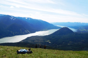 (Post-Record file photo) A hiker rests at the top of Dog Mountain in Skamania County and takes in views of the Columbia River Gorge National Scenic Area in 2017. The U.S. Forest Service announced the closure of several trails on the Washington side of the Gorge in an attempt to help stop the spread of COVID-19. 
