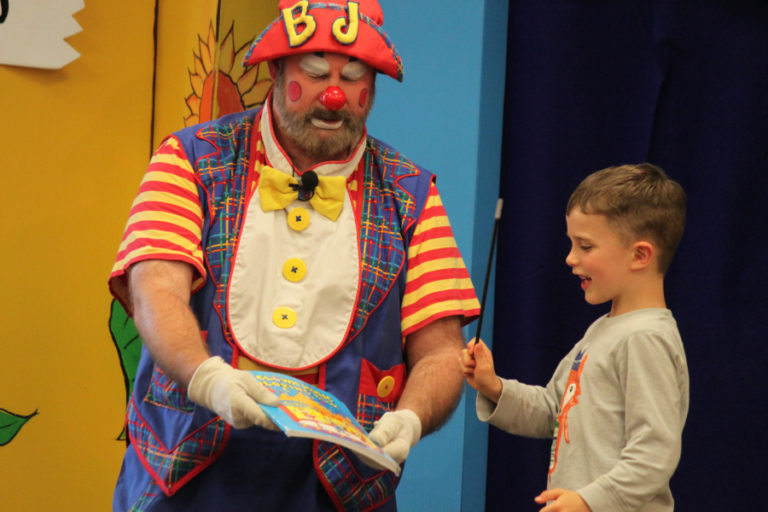 BJ the Clown visits with children at the Washougal Community Library during its summer reading program. The popular summer library programs in Camas and Washougal attract  hundreds of young readers each year.