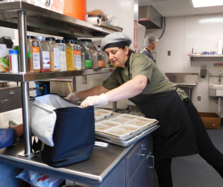 Washougal Meals on Wheels chef Valentina Diriyenko prepares food for drivers to transport.