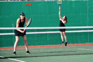 Rebecca Boylan (right) delivers a serve, while Beyonce Bea readies for the return. On May 13, the Washougal High School junior and sophomore captured the 2A sub-district doubles championship, at the Mint Valley Racquet Club in Longview. 
