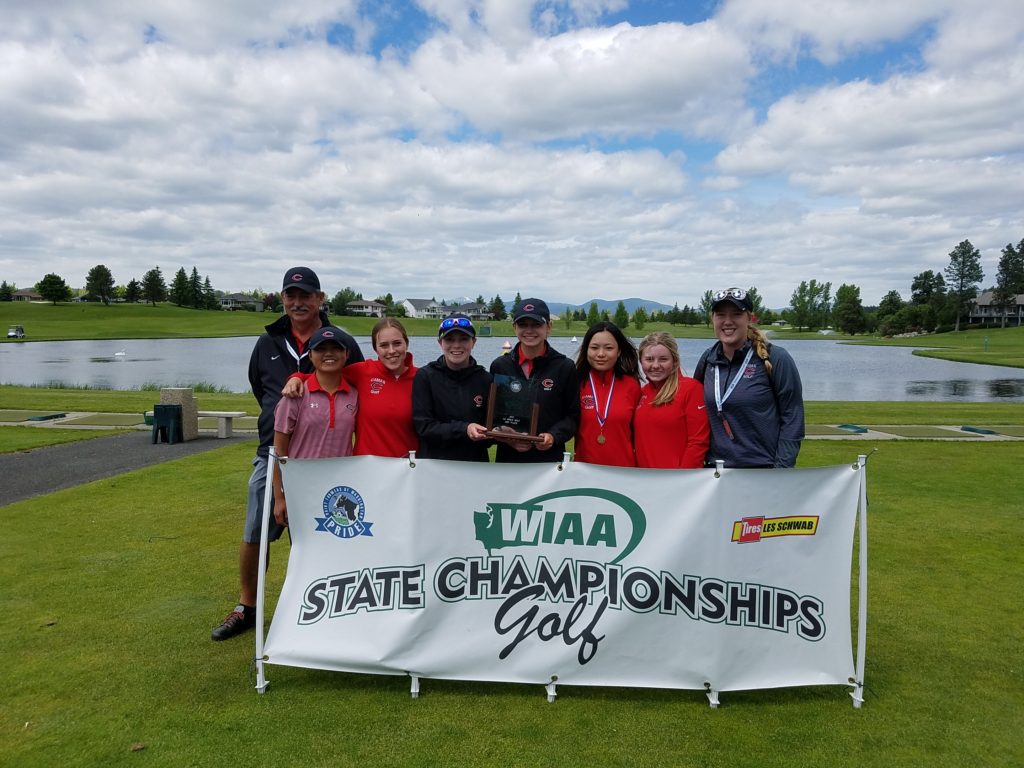 Members of the Camas High School girls golf team pose with the second place trophy they won on the MeadowWood course Wednesday, in Spokane.