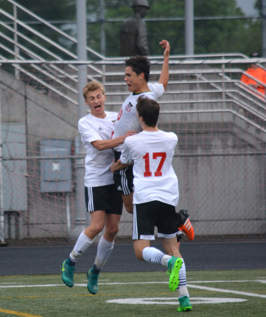 Toby Pizot jumps for joy after scoring the tying goal for the Camas boys soccer team. The Papermakers then won the game in double overtime.