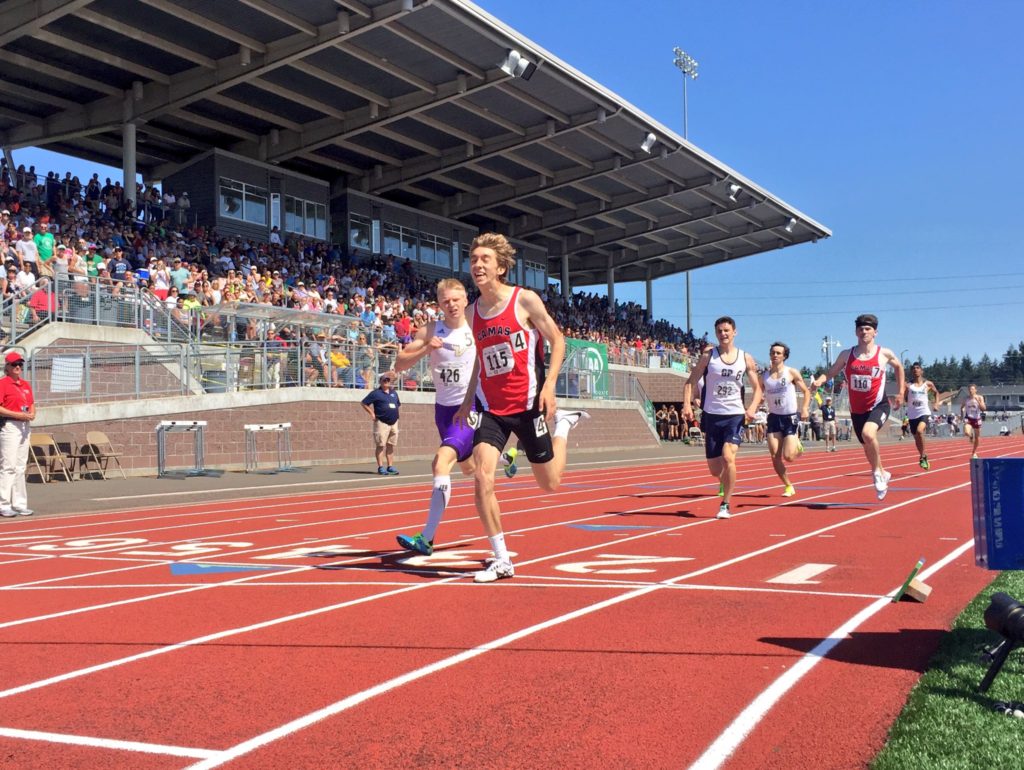Daniel Maton crosses the finish line first for Camas in the 800-meter state championship race Saturday, at Mount Tahoma Stadium in Tacoma. Cade Greseth follows in fourth place for the Papermakers. Picture courtesy of the WIAA